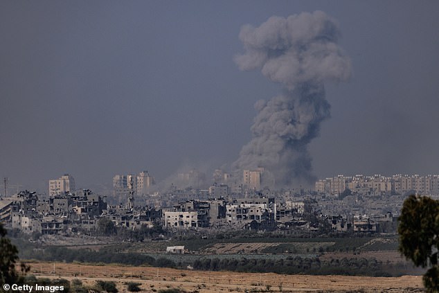 Smoke rises from an explosion in Gaza on Saturday.  Israel says troops are still deployed and continuing their campaign