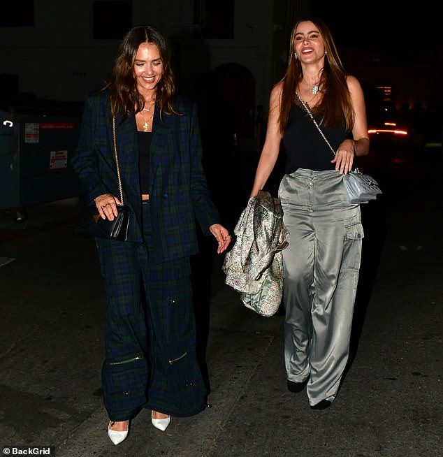 Besties: The brunette beauties looked chic and like they were thoroughly enjoying each other's company