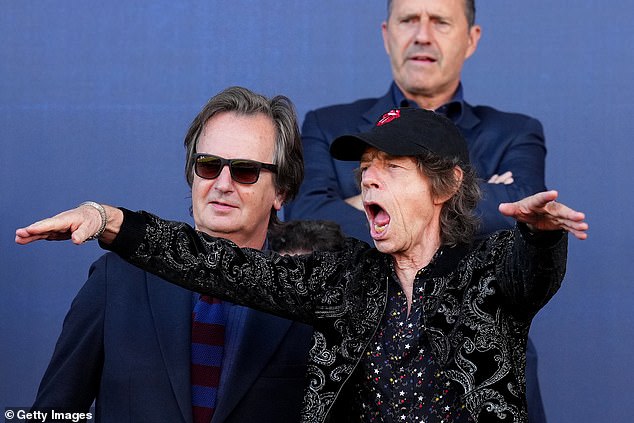 Moves like Jagger!  Mick showed off his signature moves as he cheered and jumped out of his seat