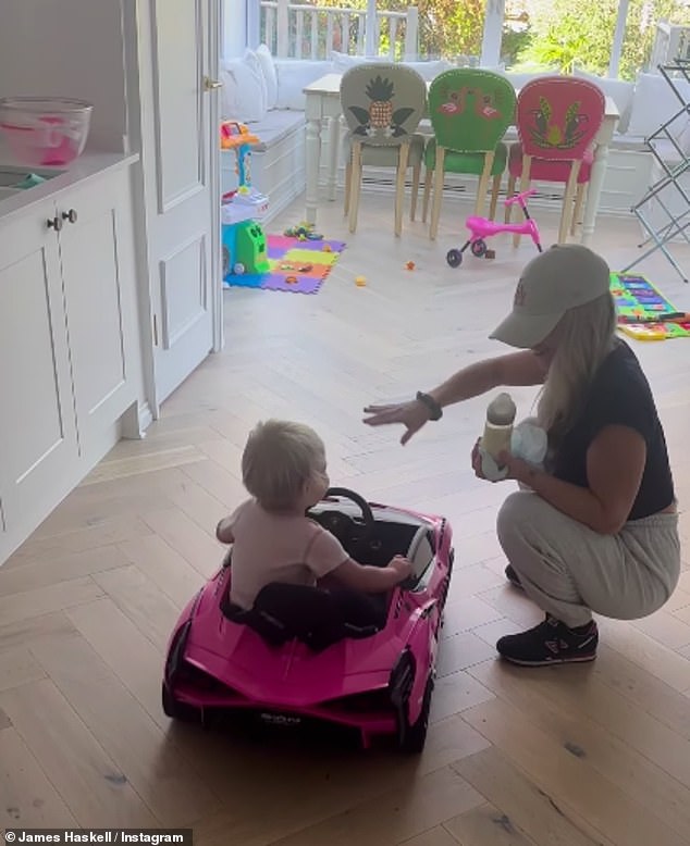 Having fun: He posted a video of their 14-month-old daughter Bodhi driving a toy car in their kitchen