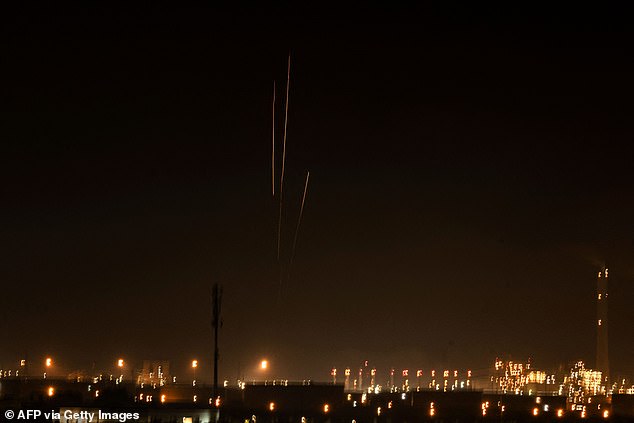 A photo taken from the southern city of Ashkelon in Israel shows rockets fired from the Gaza Strip on October 28