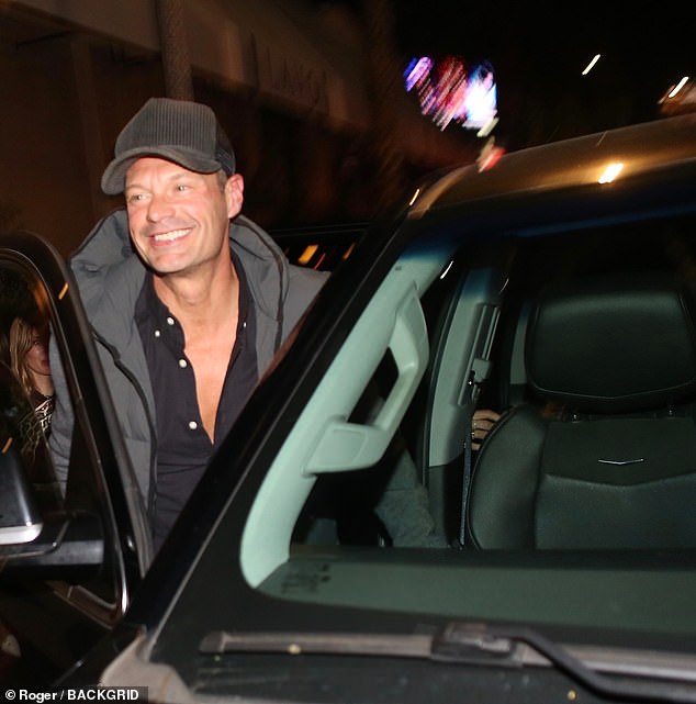 Sassy: The American Idol presenter, 48, was spotted leaving celebrity hotspot The Fleur Room with a mystery woman who put on a very sassy display as she climbed into the back of his car