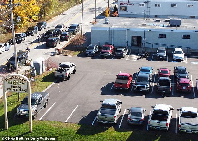 Exclusive photos from DailyMail.com and drone video footage reveal what appears to be at least 23 cars and pickup trucks still where their owners left them at Schemengees Bar & Grill in Lewiston before the horror on Wednesday night