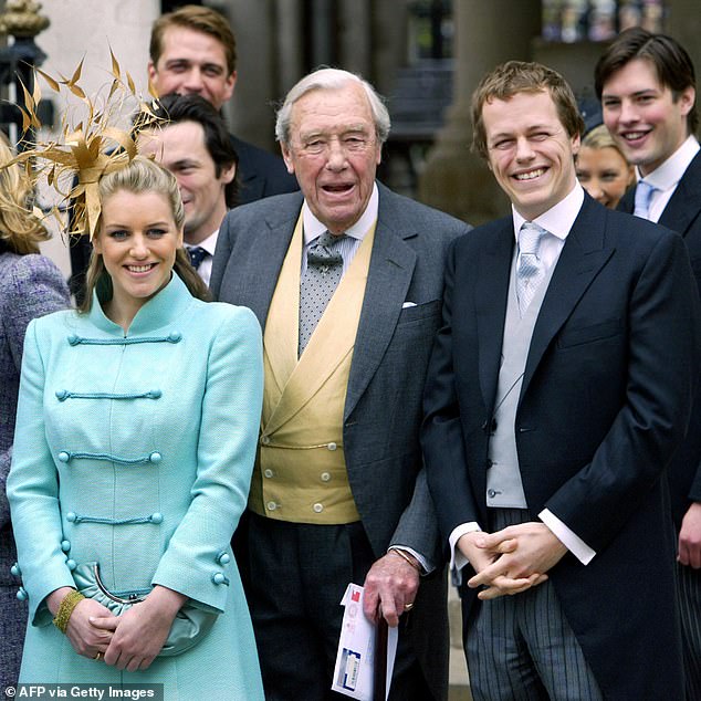 Camilla Parker Bowles' children, Tom and Laura Parker Bowles, stand with her father, Major Bruce Shand, after Prince Charles and Camilla's civil wedding ceremony in April 2005