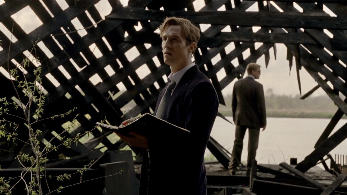 (LR) Matthew McConaughey and Woody Harrelson standing in the ruins of a dilapidated, burned-out church during True Detective.