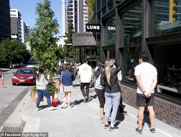 Customers outside the Lune Croissanterie wait in line to taste one of the world's best croissants.  It is now facing calls for a boycott among some members of the Jewish community