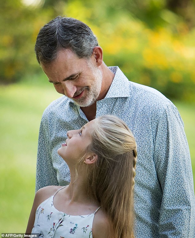 Spain's King Felipe VI and his daughter Princess Leonor pictured posing in the gardens of the Marivent Palace on the island of Mallorca in August 2019