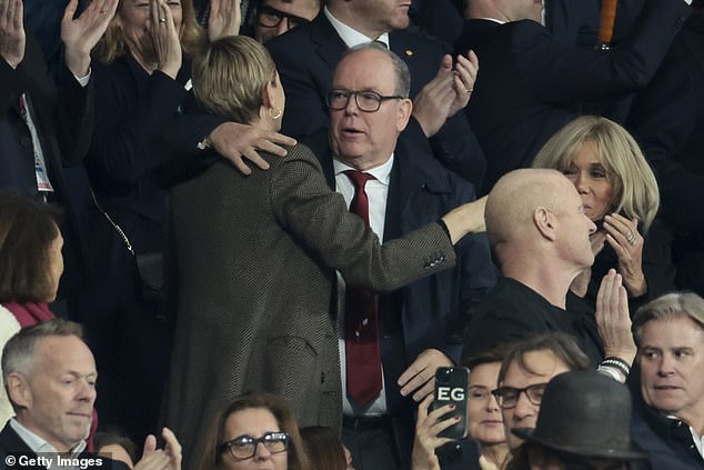 Meanwhile, Prince Albert, 65, was smartly dressed in a white shirt and red tie, with a navy blue jacket