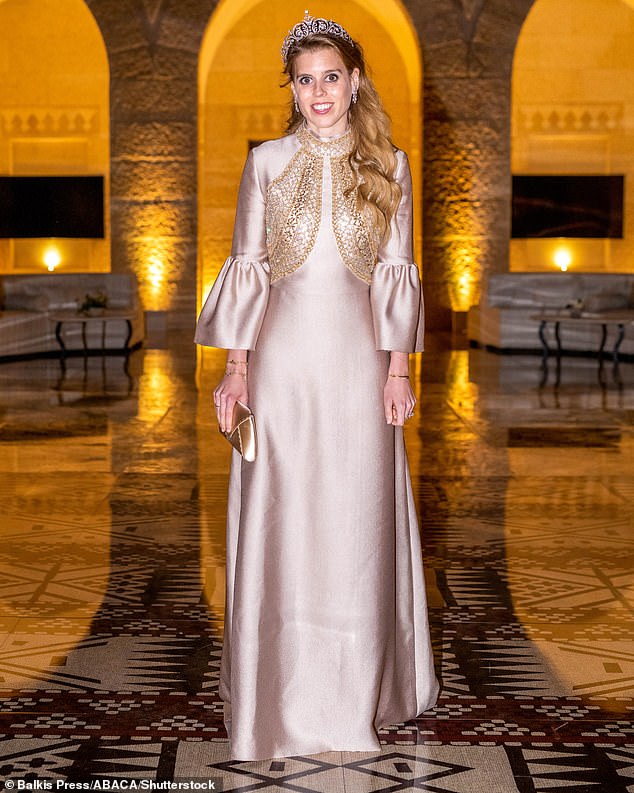 For the state banquet following the wedding of Crown Prince Hussein and Rajwa Al Saif in Jordan, the mother of one wore a satin dress with an embellished bodice by Reem Acra.