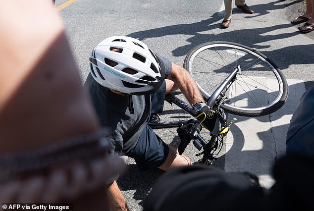 Biden, the oldest American president ever, sits on the sidewalk after the fall earlier this year