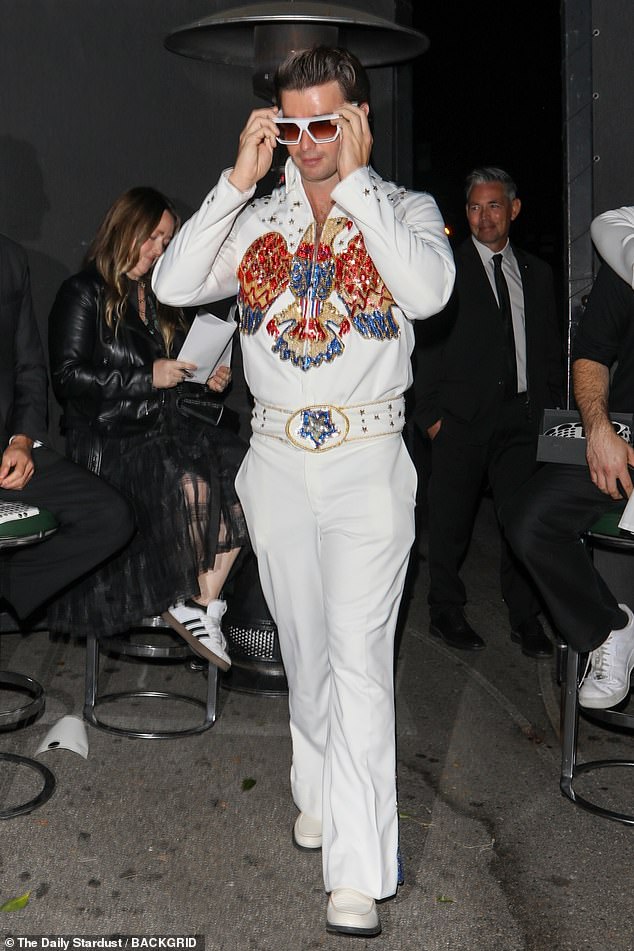 Burning love: The son of Arnold Schwarzenegger, 76, and Maria Shriver, 67, was a very convincing Elvis in his elaborate jumpsuit and sunglasses