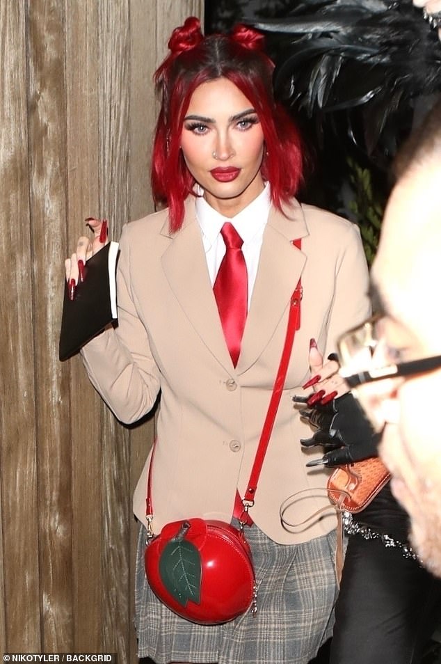 Accessory: The silver screen siren wore a red apple crossbody bag