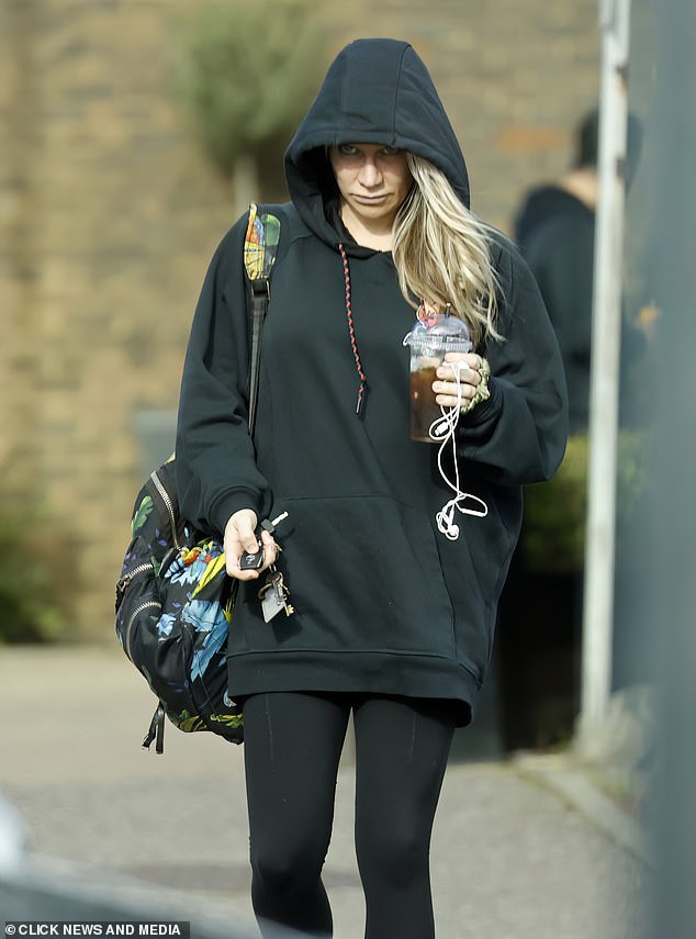 Understated look: Madeley looked casual in a black hooded top and matching leggings