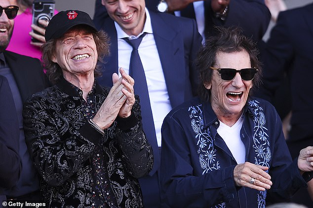 Here for: Mick Jagger and Ronnie Wood put on a very animated show during the exciting football match between Barcelona and Real Madrid, where the limited edition shirt debuted