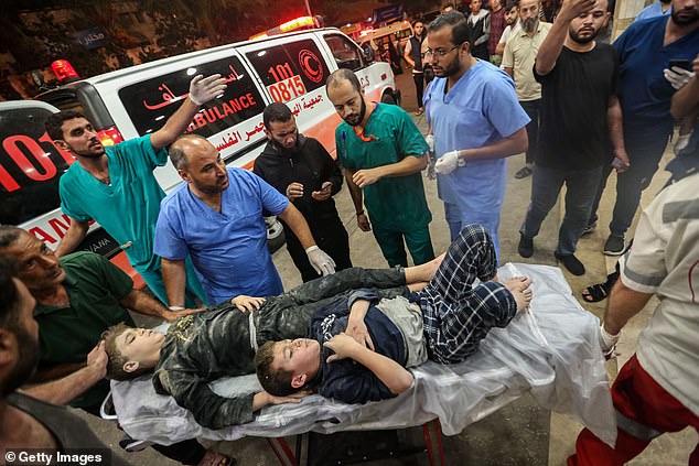 Palestinians injured in Israeli airstrikes arrive at Nasser Medical Hospital on Sunday