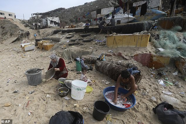 Palestinians resort to using the seawater to bathe and clean their tools and clothes amid Gaza Strip's water shortage