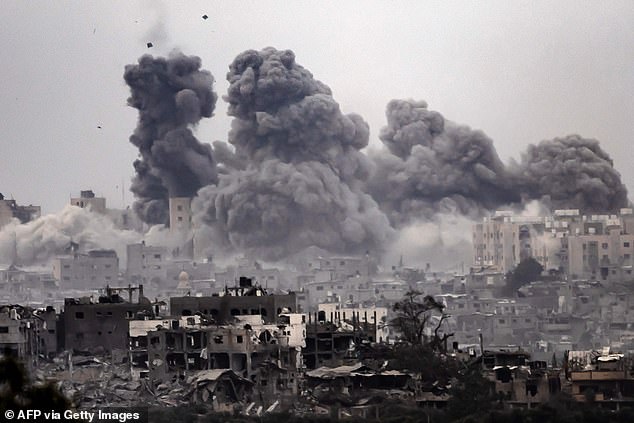 Smoke rises after Israeli forces bomb the Gaza Strip as fighting continues