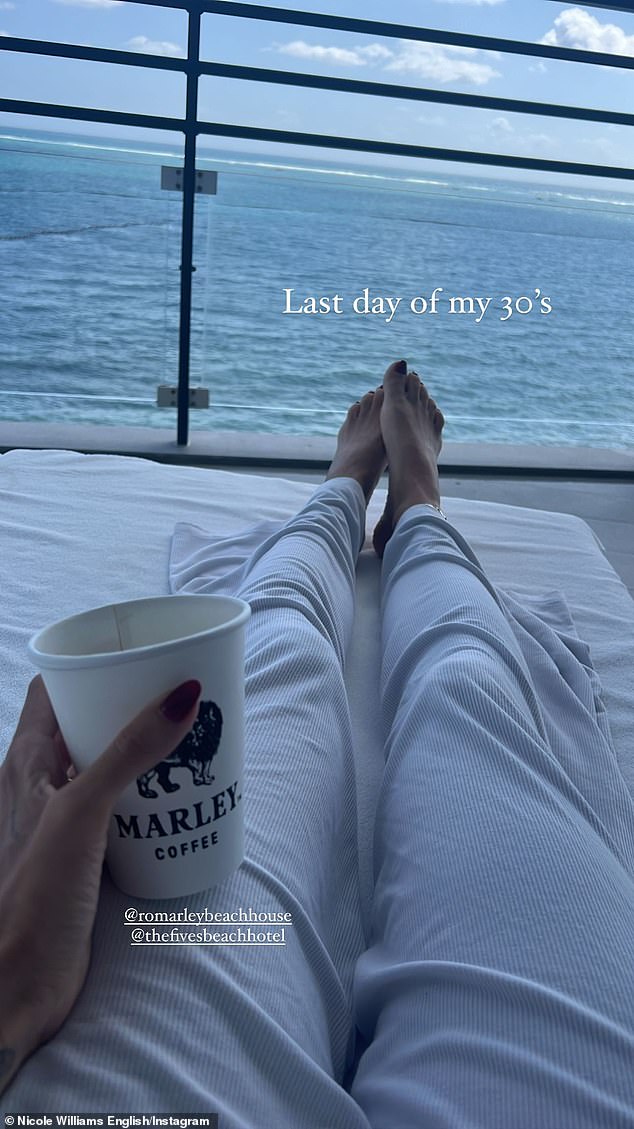 Picturesque: The former WAGS star relaxed on the rooftop overlooking the ocean as she tried to enjoy the 'last day of my 30s'