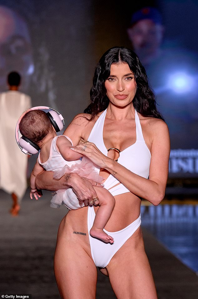 First-time mother: Williams English hit the runway with daughter India last July at the Sports Illustrated Swimsuit Show at W Hotel Miami Beach