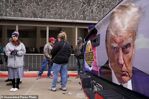 Supporters wait to attend a rally for former President Donald Trump in Sioux City, Iowa