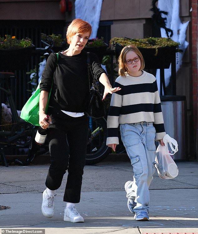 Quality time: The 38-year-old singer, wearing a sweater and jeans, was pictured walking with her daughter Marnie in New York City on Sunday