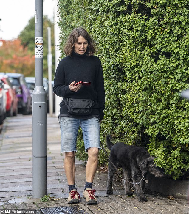 Quiet: Baxendale wore a turtleneck sweater and denim shorts for the outing