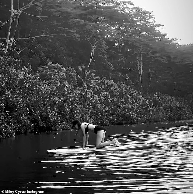 Stretching session: The Flowers singer stretched out on the paddleboard