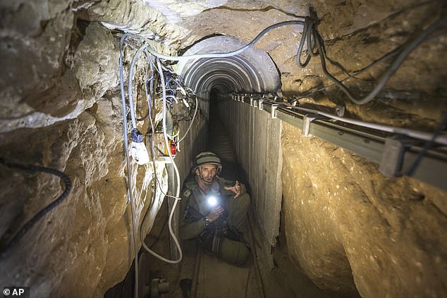 An Israeli army officer gives journalists a tour of a tunnel system reportedly used by Palestinian terrorist groups for cross-border attacks on Israel, July 25, 2014