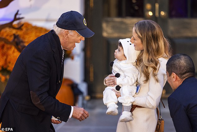 President Biden greets a trick-or-treater