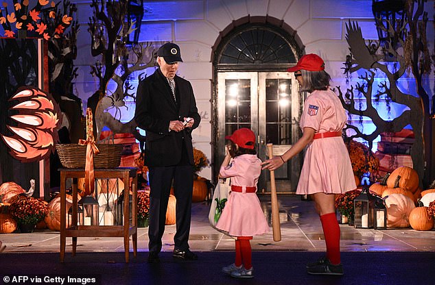 President Biden with two baseball players