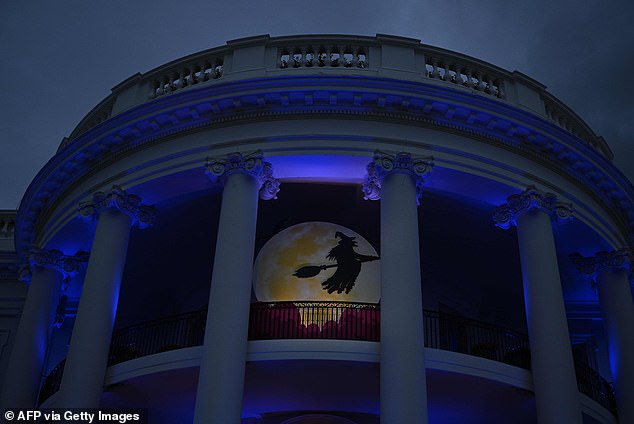 A witch flies onto the Trump balcony