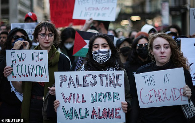 Students from Baruch College march to a demonstration in Times Square to express solidarity with Palestinians in Gaza, amid the ongoing conflict between Israel and the Palestinian Islamist group Hamas, in New York City, U.S., October 13, 2023