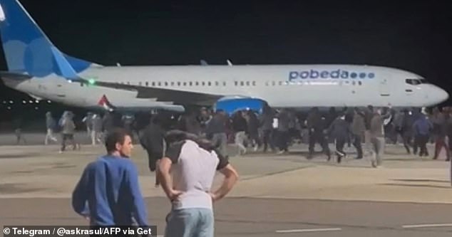 Protesters on the tarmac of an airport in Makhachkala