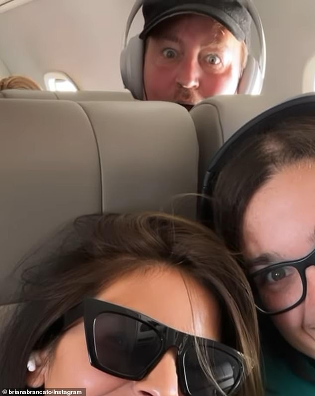 Briana (bottom left) and Perry together on a plane.  They worked together for many years before his death