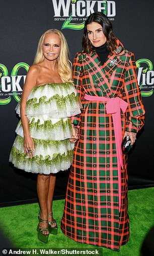 Dazzling witch: The 55-year-old actress looked right on theme as she modeled a white tiered tulle mini dress adorned with green sequins and metallic platform heels for the special event