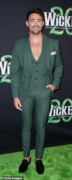 All green look: Jonathan Bennett, 42, attended the event in a low-cut, deep green cardigan that he wore without a shirt underneath.  The Mean Girls actor also wore the matching blazer and tailored trousers