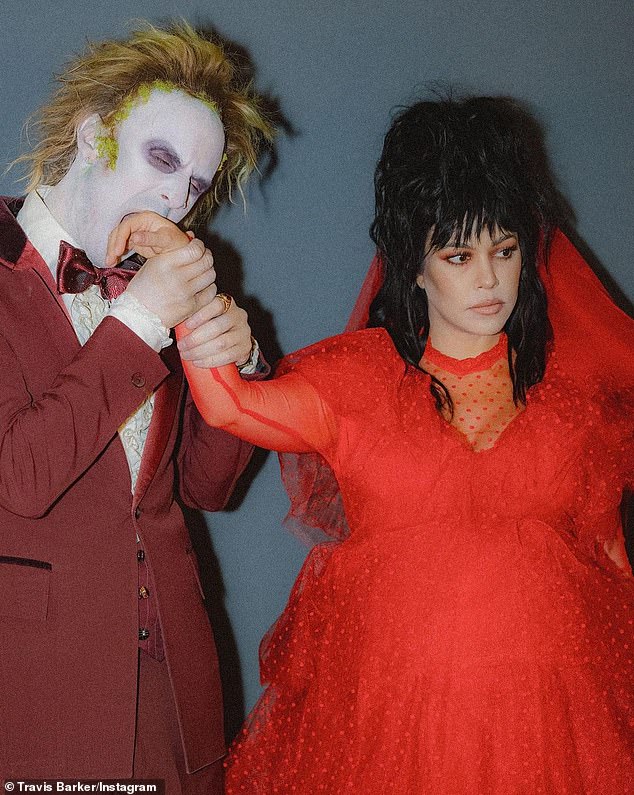 Creepy couple: The Blink-182 drummer was dressed as Beetlejuice and it was pure perfection