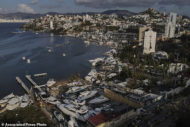 Damage was reported Saturday at a yacht club in the wake of Acapulco, Mexico