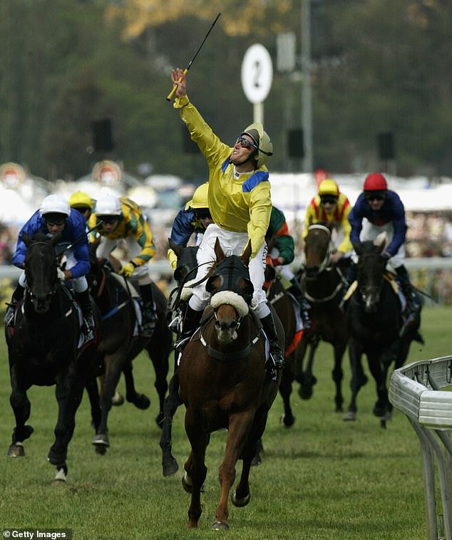 Oliver blew a kiss to his brother Jason after winning the 2002 Melbourne Cup in one of Aussie racing's most iconic images