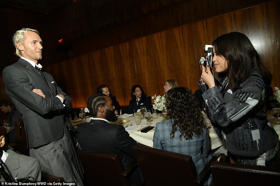 New hobby?  At one point, Jenna was seen pointing an old-fashioned camera at a dapper partygoer as she sat sideways in her chair at the dinner table.