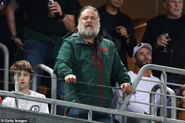 Crowe often brings big name actors to the box to watch his beloved Souths.  Here he is pictured with Avengers star Chris Hemsworth in the background