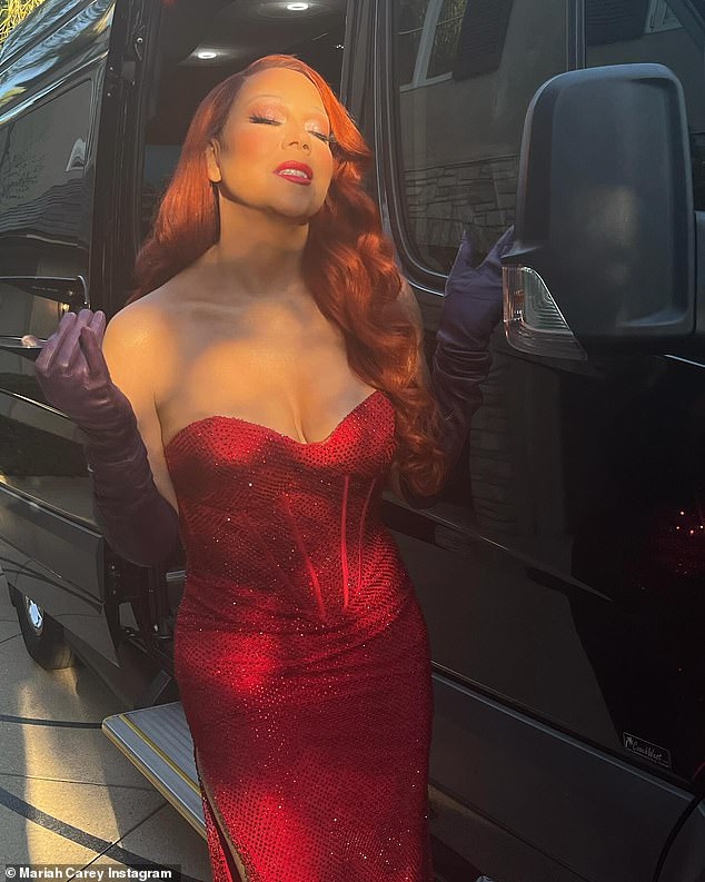 Jessica Rabbit costume: The Touch My Body hitmaker also wore a fiery red wig styled with bouncy, tight curls.  For makeup, she used a shimmering eyeshadow look paired with a bold crimson lip