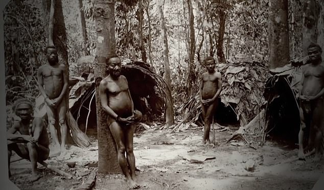 Five members of the Bambuti tribe pose for photos in their homeland