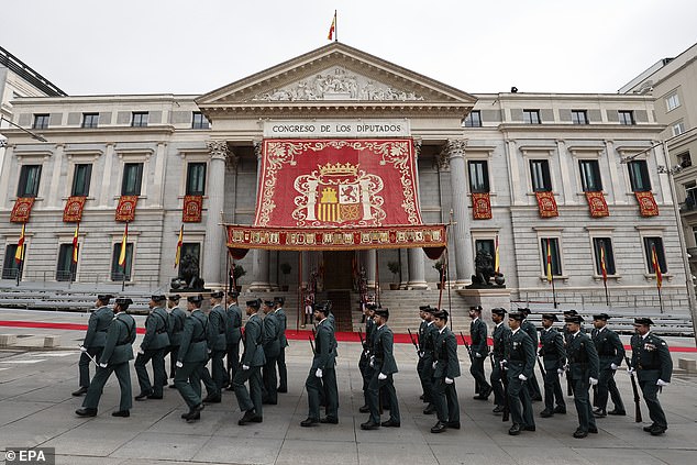 Pictured: Members of Spain's Guardia Civil patrol outside the House of Commons ahead of Princess Leonor's ceremony