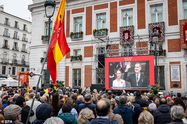 Pictured: Large numbers of royal fans gather in Puerta del Sol Square to watch Princess Leonor's swearing-in ceremony