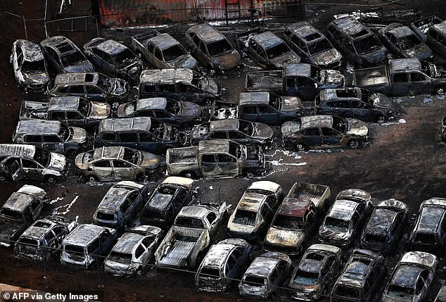 An aerial photo taken on August 10 shows destroyed cars in Lahaina in the aftermath of wildfires in western Maui, Hawaii