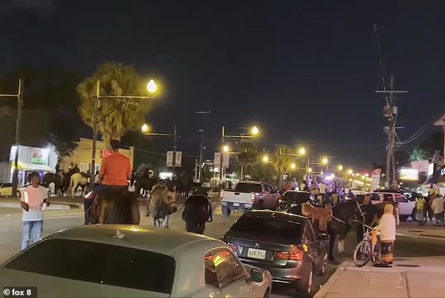 1698772361 723 Rowdy New Orleans partygoers on HORSEBACK take over intersection then