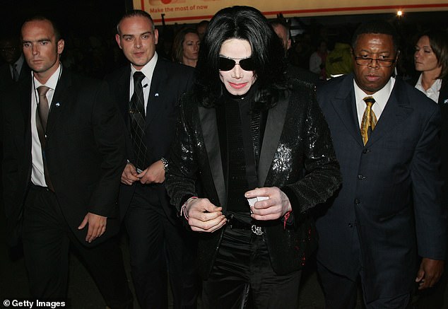 Simon's stint as a celebrity bodyguard began by chance in 2003, when he was on a break from work in Afghanistan and at home in London, when he was asked to take a job protecting Michael Jackson (pictured)