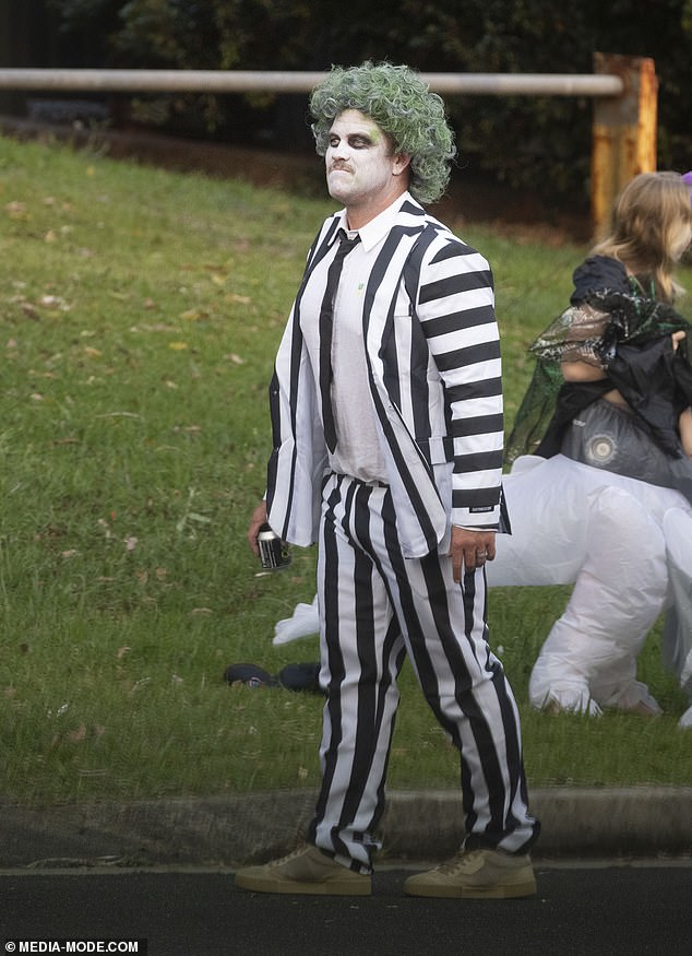 Meanwhile, her husband Chris' brother Luke Hemsworth (pictured) wore a Beetlejuice-inspired outfit that consisted of black and white stripped clothes and a green colored wig.