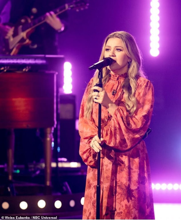 Sing it: She stood on stage playing a tune